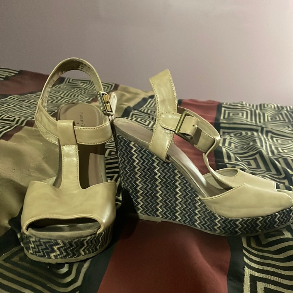 Pair of wedges, they were worn when I was younger. They are size 8 Faded Glory.